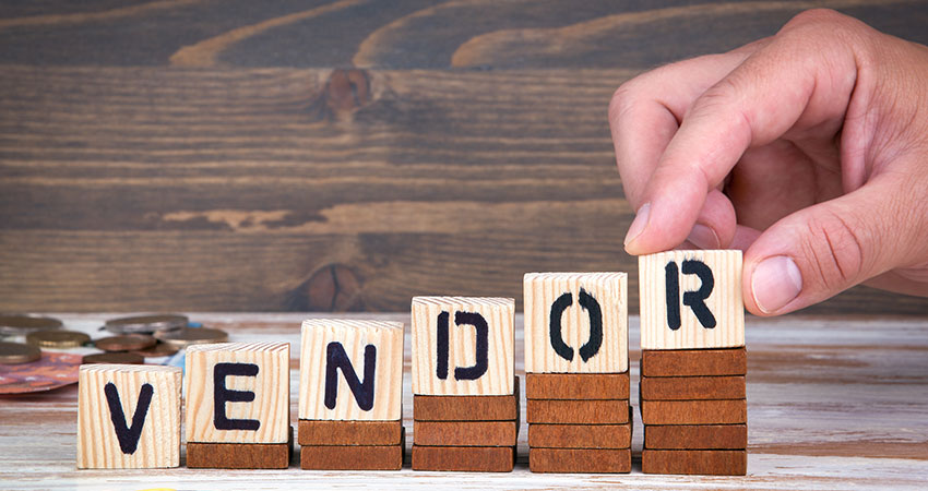Image of a hand playing scrabble with the letters Vendor to imply Horizon Controls Vendor Agnostic Approach