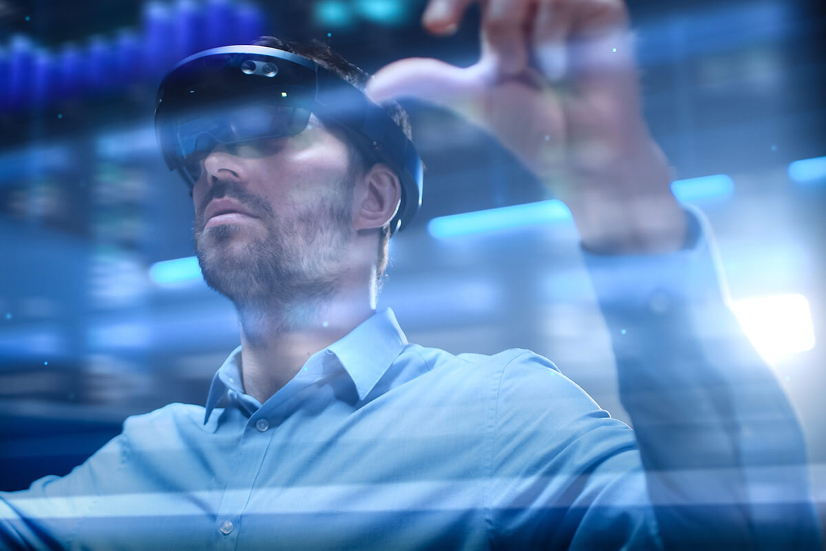 A man using a VR Headset to display Digital Transformation
